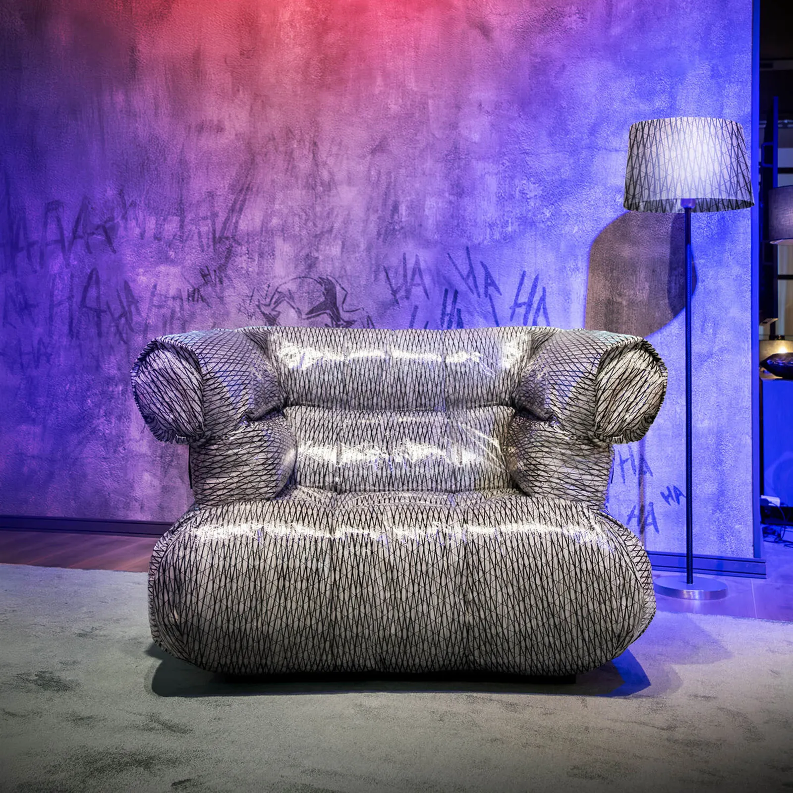 Asylum Armchair upholstered in sailcloth fabric with a carbon fibre texture.